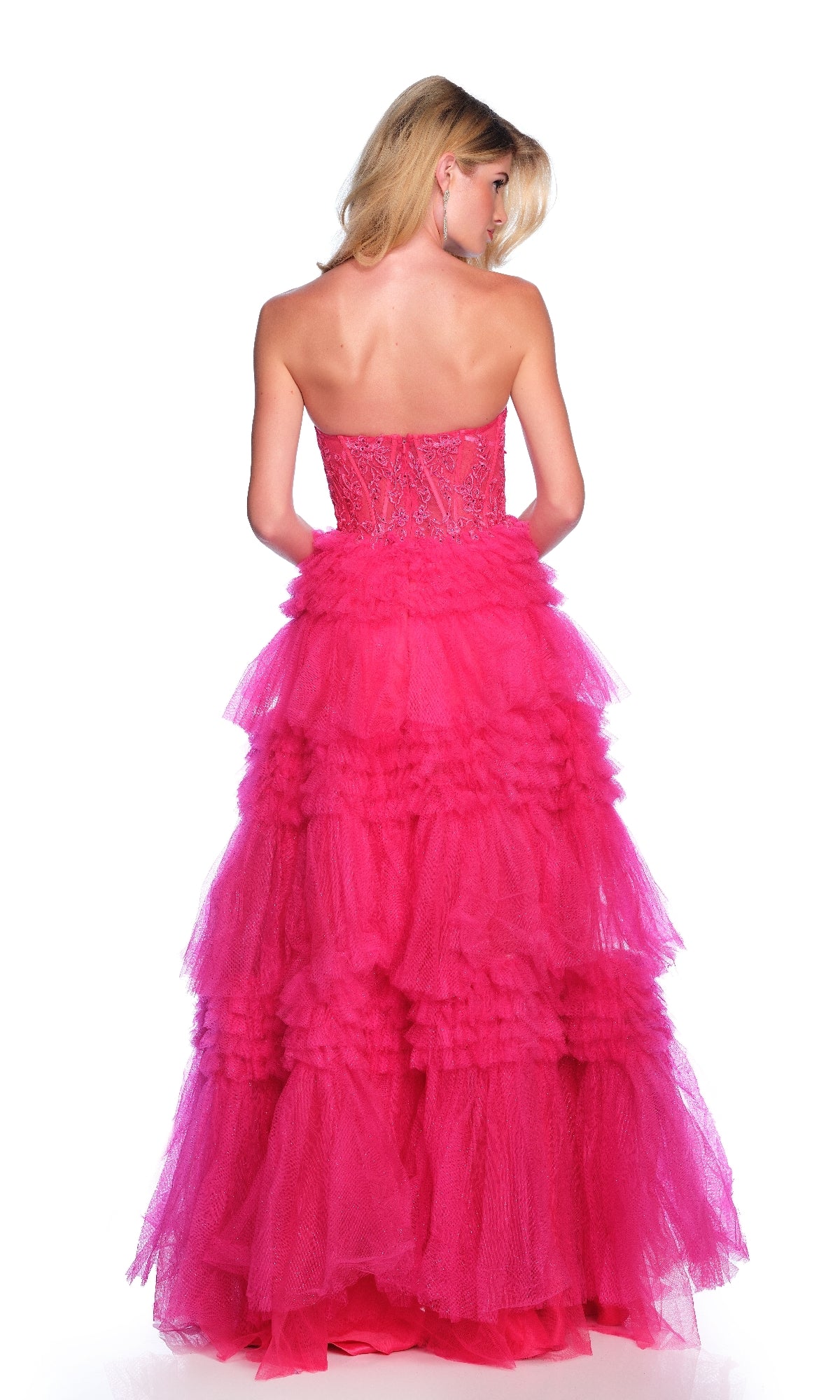 A woman faces away, wearing the Fuchsia Pink Prom Ball Gown: Dave & Johnny 11845, featuring a strapless embellished corset bodice and ruffle tulle skirt, set against a white background.